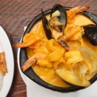 Cazuela De Mariscos · Cream seafood soup. With rice, french fries and salad.