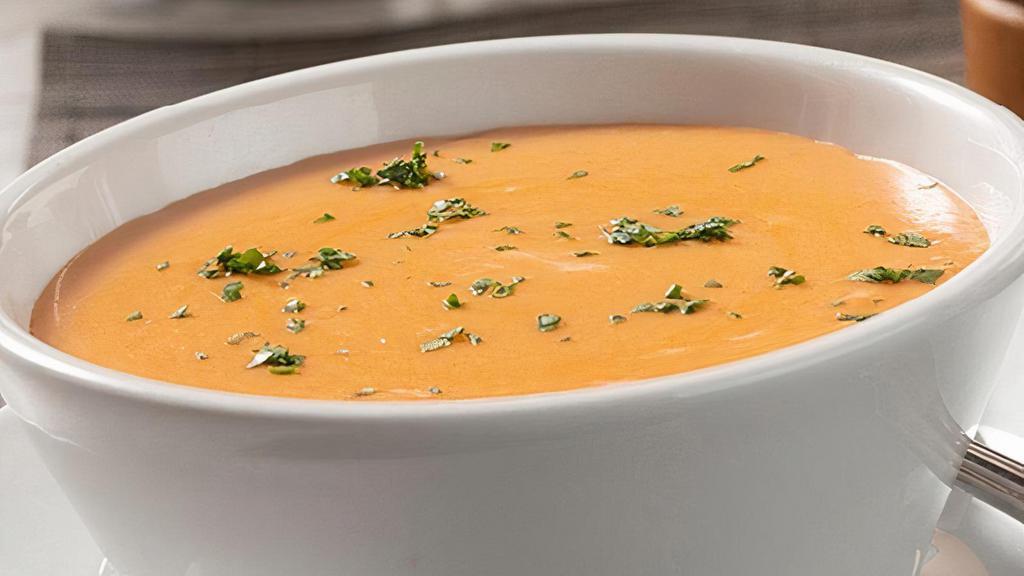 Lobster Bisque · A light cream lobster bisque with a touch of sherry.