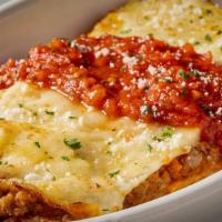 Mezza Lasagna · Half Portion. Our signature meat sauce, house-made alfredo, ricotta, mozzarella.