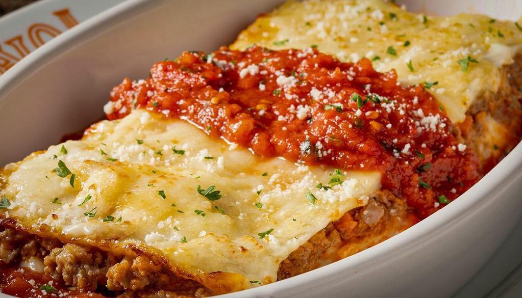 Lasagna · Our signature meat sauce, house-made alfredo, ricotta, mozzarella.