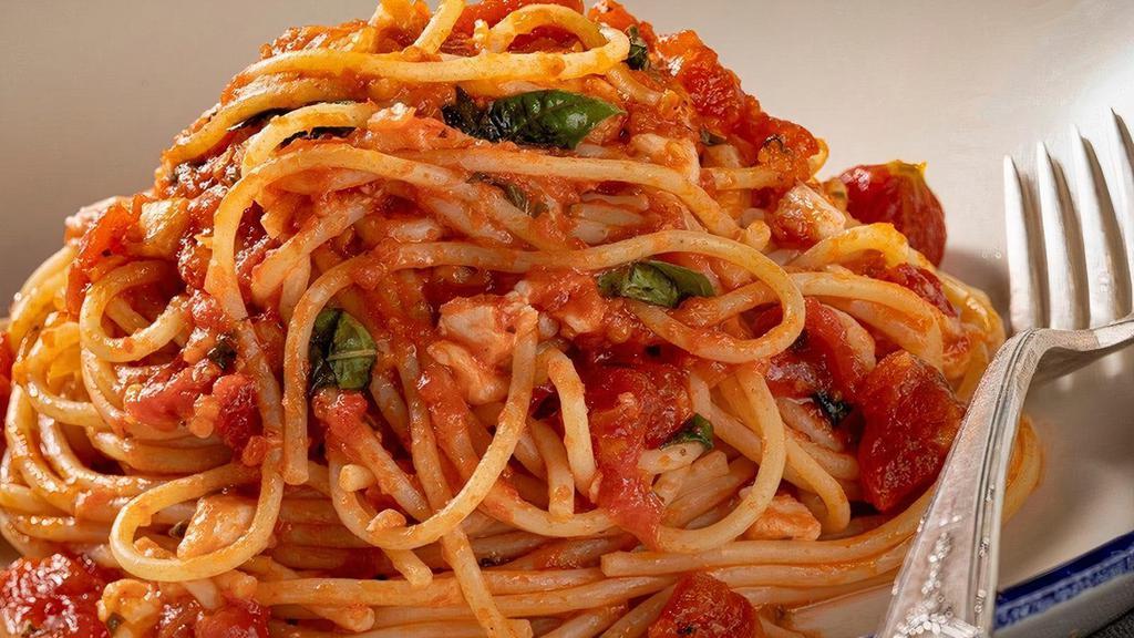 Spaghetti Pomodoro · House-made tomato compote, basil, parmesan .