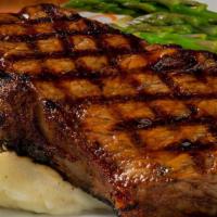New York Strip* · 14 oz strip steak, mashed potatoes, seasonal vegetables.