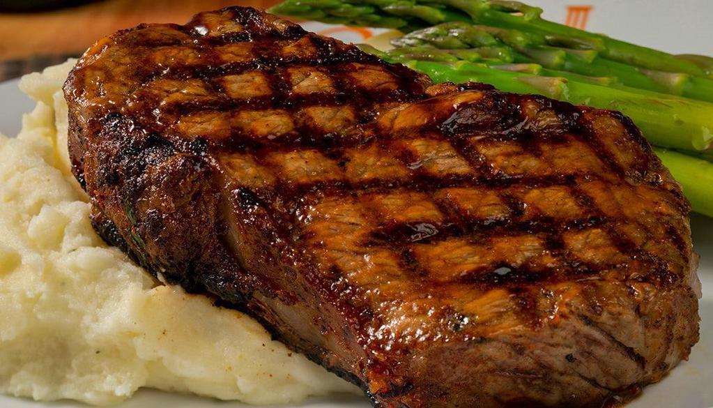 New York Strip* · 14 oz strip steak, mashed potatoes, seasonal vegetables.