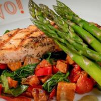 Grilled Salmon* · Fresh salmon, roasted peppers, grilled asparagus, tomatoes, spinach, sweet potatoes, pesto v...
