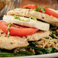 Chicken Caprese · Pan-seared chicken, spinach, tomatoes, zucchini, mozzarella, orzo, farro, pesto vinaigrette,...