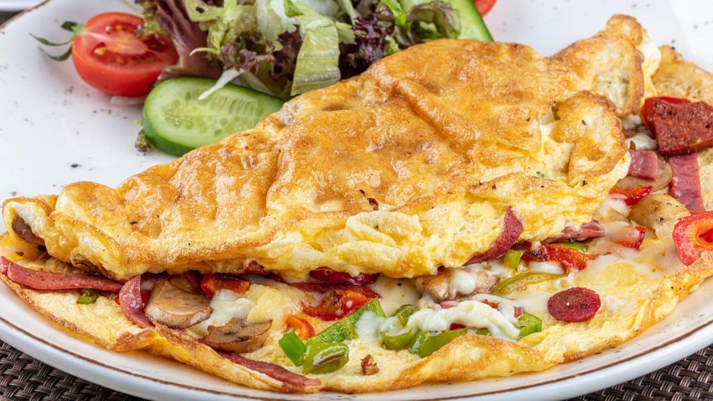 Classic Egg Omelette · Classic omelette with ham and american cheese. Served with home fries & toast.