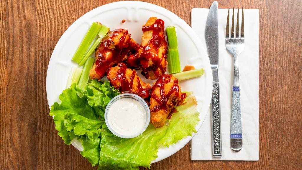6 Piece Wings · (hormone free chicken) served with celery and choice of dipping sauce.