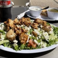 Vlaho Salad · Romaine Lettuce, Tomatoes, Cucumbers, Feta Cheese, Dill and scallions topped with homemade v...