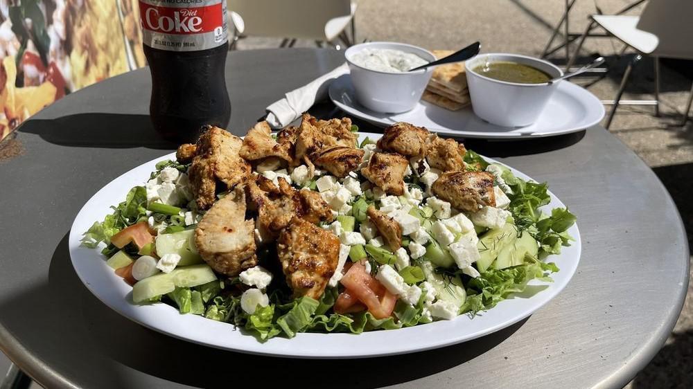 Vlaho Salad · Romaine Lettuce, Tomatoes, Cucumbers, Feta Cheese, Dill and scallions topped with homemade vinaigrette dressing. Served with a warm pita bread.