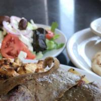 Gyro Dinner Platter · Thinly sliced Rotisserie Lamb & Beef.  Served with  warm pita bread on the side. Served with...