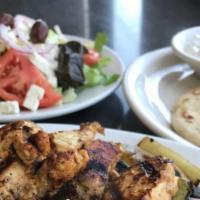 Chicken Souvlaki · Chunks of Chicken. Marinated and Char-Broiled.  Served with  warm pita bread on the side. Se...