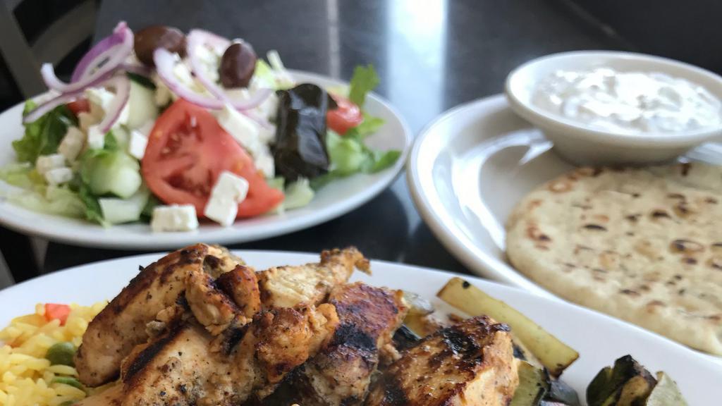 Chicken Souvlaki · Chunks of Chicken. Marinated and Char-Broiled.  Served with  warm pita bread on the side. Served with salad or soup. Served with 2 sides.