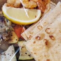 Shrimp Souvlaki Dinner Platter · Marinated and Broiled Shrimp. Served with a warm pita bread on the side. Served with a choic...
