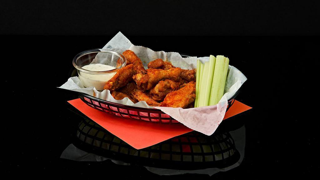 Chicken Wings · Crispy fried chicken wings tossed in your choice of sauce. Served with celery and ranch or blue cheese.