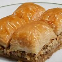 Baklava · Sweet dessert pastry with layers of filo dough filled with chopped walnuts sweetened and hel...