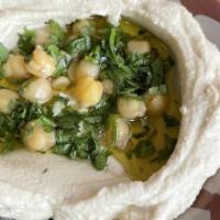 Hummus · Chickpea puress, tahini, lemon, garlic, and olive oil.