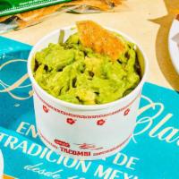 Guacamole Con Totopos. · Traditional guacamole made with ripe Hass avocados, fresh cilantro, jalapeño, onions and lim...