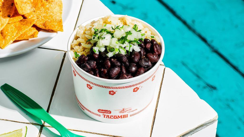 Rice & Beans. · Traditional Mexican arroz verde served with beans cooked with tomatillo, epazote and poblano pepper, topped with cilantro and onion.