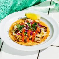 Seared Fish Taco. · Responsibly sourced Cod marinated in a mojo de cilantro, seared on the plancha served with r...