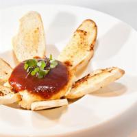 Goat Cheese · Served crispy with plum sauce and toasted garlic bread.