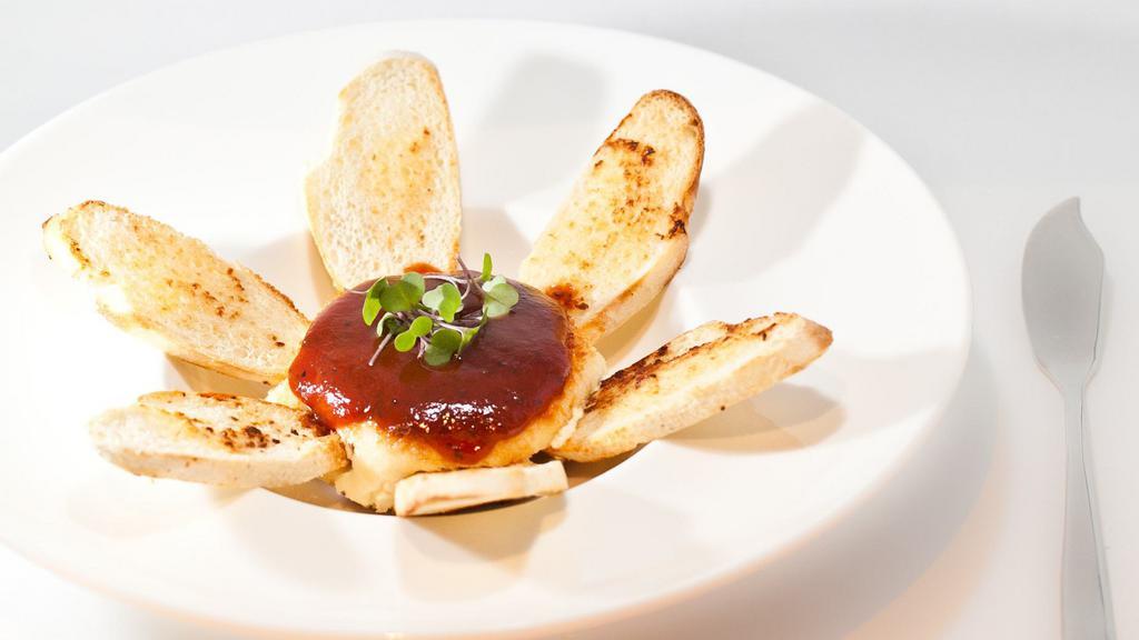 Goat Cheese · Served crispy with plum sauce and toasted garlic bread.