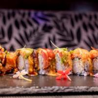 Mummy Roll · Shrimp tempura and cucumber inside, topped with lobster meat, seared pepper tuna and avocado...