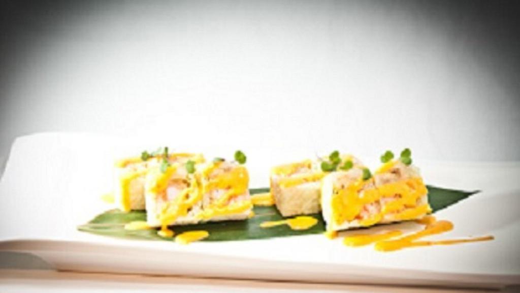 Paradise Roll · Spicy. Spicy lobster, shrimp tempura, and fried banana wrapped with soy seaweed and yuzu mango sauce.