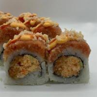 Spicy Status Roll · Spicy salmon, spicy kani, and jalapeño topped with spicy tuna, crunch, and spicy sauce combo.