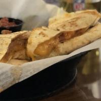 Buffalo Chicken Quesadilla · Served with Blue Cheese Dressing