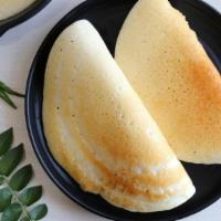 Plain Dosa · A fresh made thin Indian crepe made from a fermented batter of lentils and rice. Make it a m...