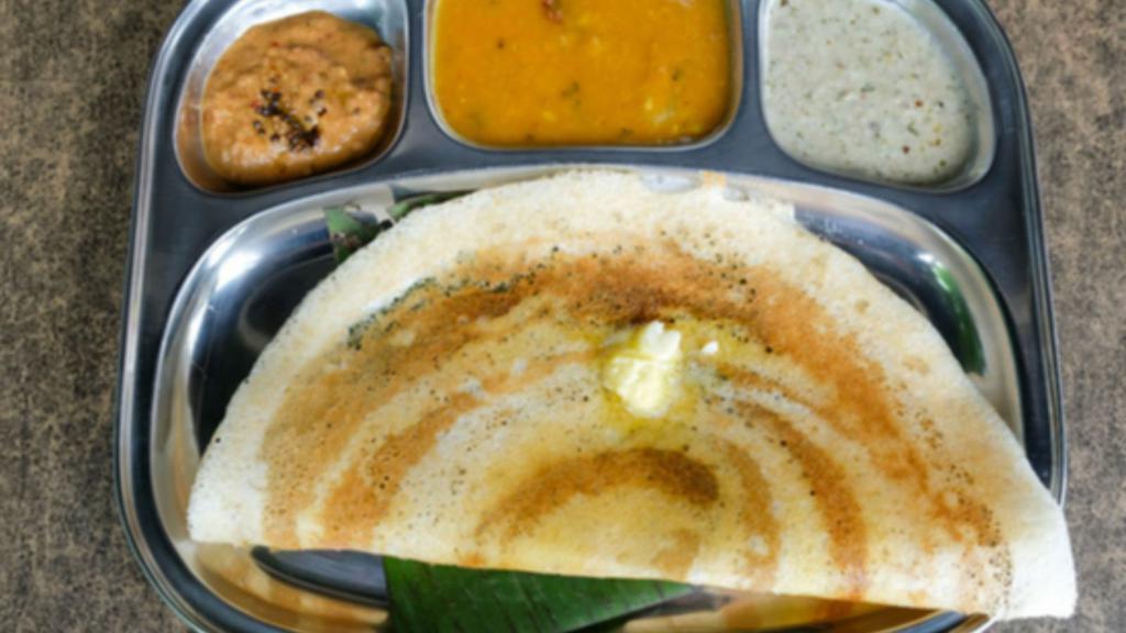 Mysore Dosa · A fresh made thin Indian crepe made from a fermented batter of lentils and rice, topped with red garlic chutney and potato masala. Make it a masala (spiced) dosa for an additional charge.