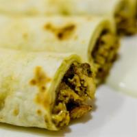 Paneer Burji Roll · A flaky round of buttery paratha wrapped around our cheesy paneer and spices.