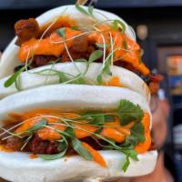 Bao Bun With Grilled Chicken Tikka
 · Onion, pepper, cheese, curry leaves.