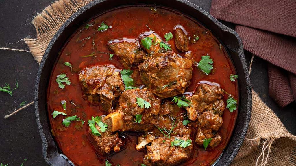 Mutton Curry (Goat) · Slow cooked in light onion and tomato gravy.