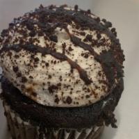 Cookies & Cream · Serves one. Rich chocolate cake iced with oreo buttercream, topped with crushed oreos.