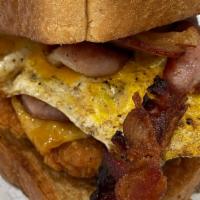 Nipsey-Sandwich · Southern Fried Chicken, Applewood Smoked Bacon, Fried Eggs & Cheddar Cheese served on Texas ...