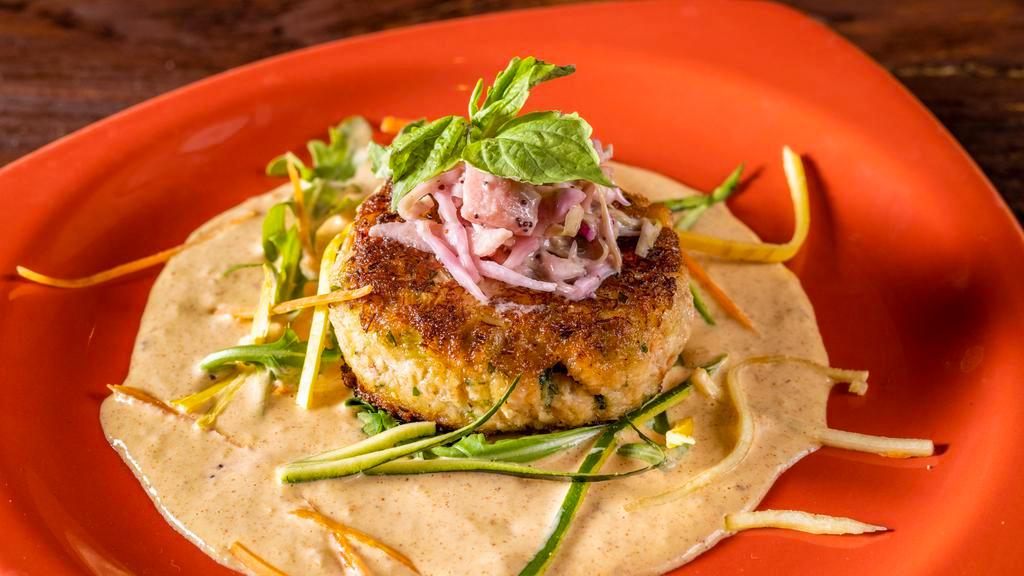 Crab Cake · Homemade lump crab meat, spicy mango aioli, and apple Coleslaw.