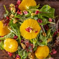 Goat Cheese Salad · Mesclun greens, navel orange, dried cranberries, roasted walnuts, and fried goat cheese toss...