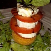 Caprese Salad · Grilled polenta, vine tomatoes, fresh mozzarella. E.V.O, drizzle with balsamic glaze.