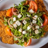 Pork · Milanese style with mixed greens, tomato, mozzarella, red onions, and balsamic vinaigrette.