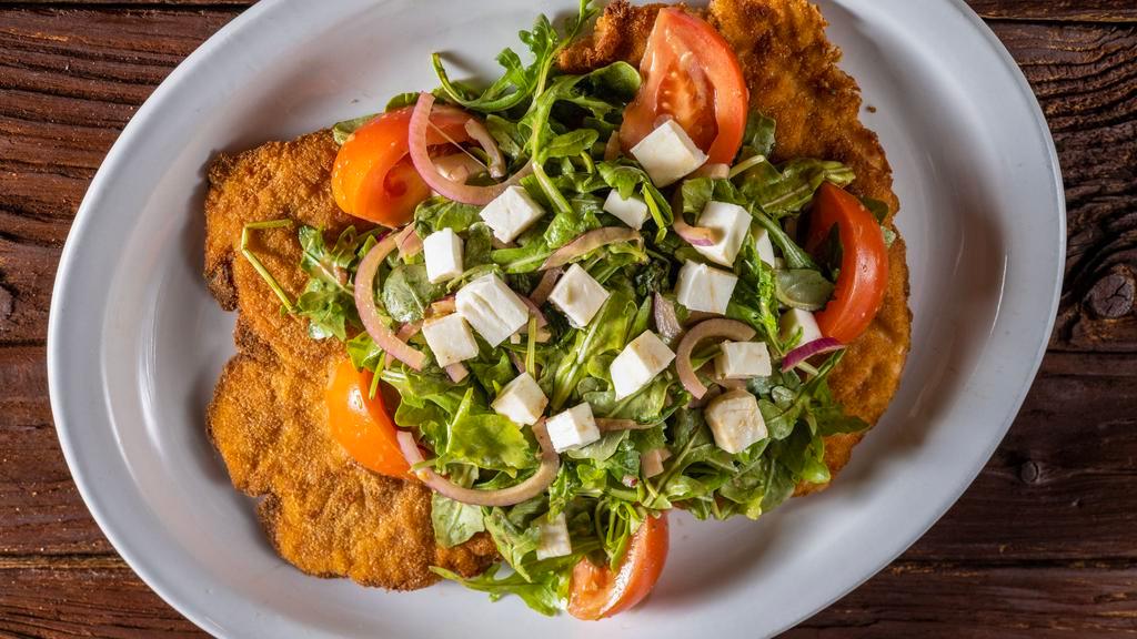 Pork · Milanese style with mixed greens, tomato, mozzarella, red onions, and balsamic vinaigrette.