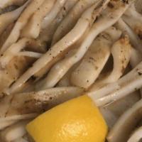 Calamari · Marinated and grilled to perfection or quick-fried and served with freshly sliced lemon and ...