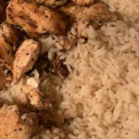 Chicken Souvlaki Dinner · Grilled marinated chicken served over our house-made rice with a small Greek salad and a sid...