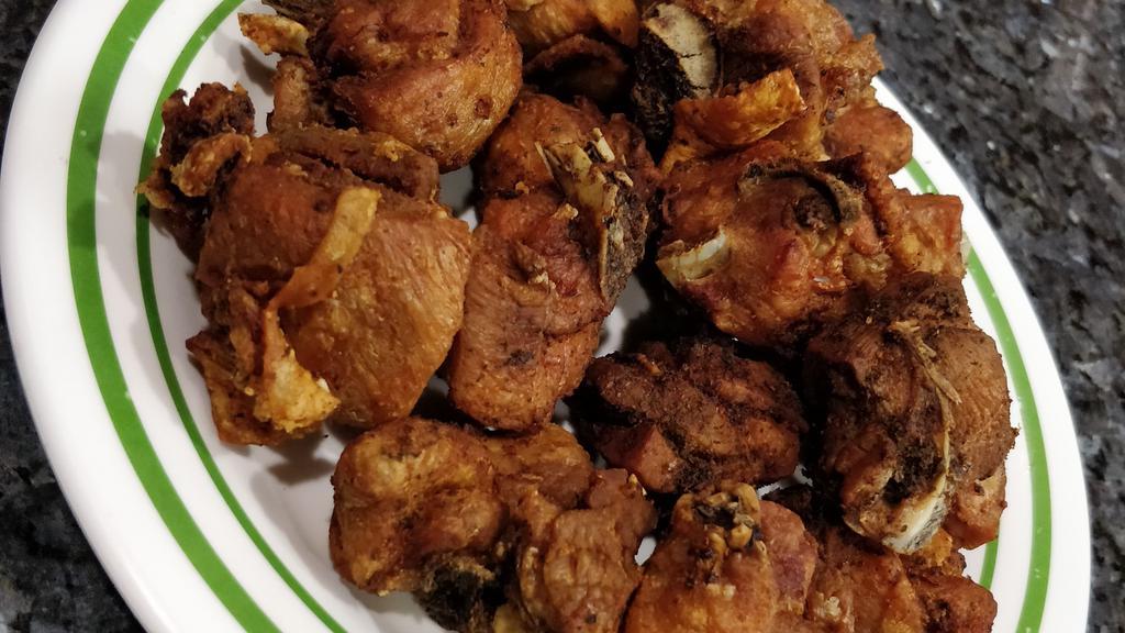 Fried Chicken Chunks / Con Hueso · Fried Chicken Chunks with Bones Our Special Dominican Seasoning Added, with your Choice of Breaded or Unbreaded Chunks. Also with a Side Option of your Choice, Plus a Small Green Salad on the Side.