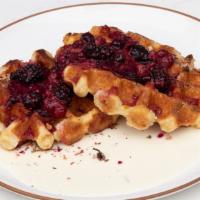 Rose Berry Waffles · Belgian waffles, rosewater berries, and sweet cream.