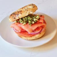 Smoked Salmon Bagel · Cream cheese, caper relish, tomato, red onion with toasted bagel.