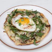 Breakfast Pizza · egg, parmesan, wild mushrooms, red onion, arugula, truffled pesto on flatbread