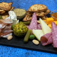 Charcuterie Board · Contains Nuts. Artisanal Cheeses, Selected Meats, Accoutrements