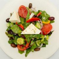 Greek Salad · Romaine lettuce, tomatoes, cucumbers, red onions, olives, bell peppers, feta cheese and Myko...