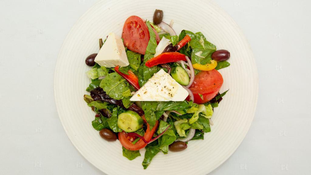 Greek Salad · Romaine lettuce, tomatoes, cucumbers, red onions, olives, bell peppers, feta cheese and Mykonos vinaigrette.